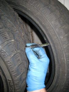 Measuring the tread depth on a tire, Subaru